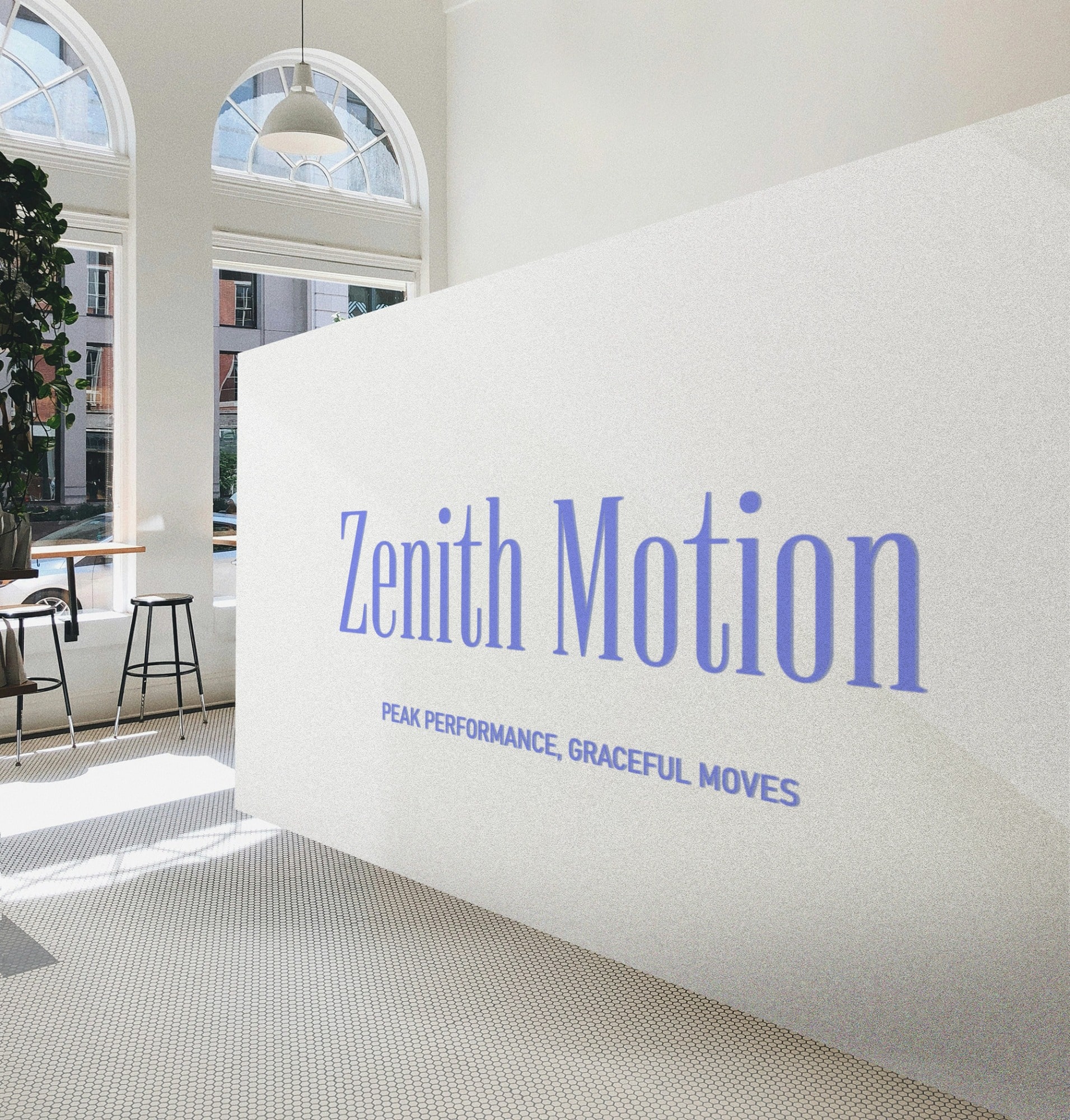 A modern, sunny room with large arched windows, indoor plants, and bar stools near a counter. Prominently featured is a white partition wall with "Zenith Motion" in blue text and the slogan "Peak Performance, Graceful Moves" below it.